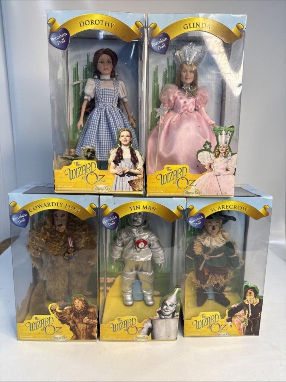Wizard of Oz Brass Key Porcelain Doll Set of 5 Dorothy Toto Tin Man Scarecrow